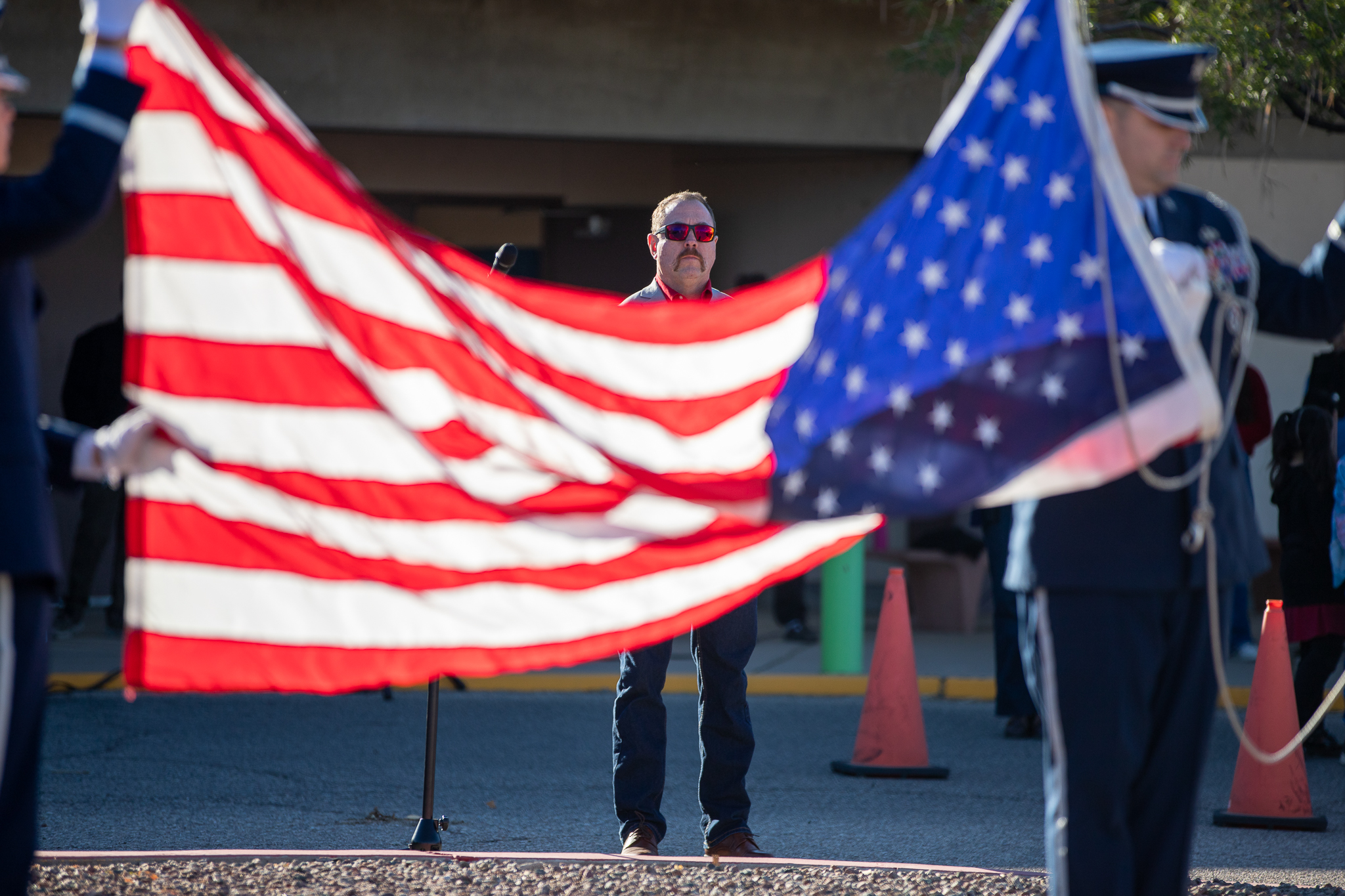 Borman's principal watches as the American flag is raised