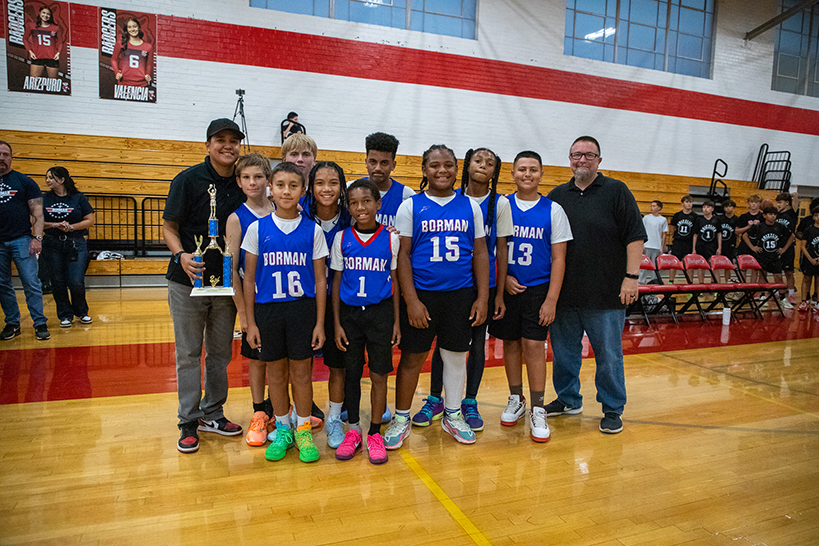 The Borman boys basketball team smiles after the game